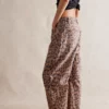 Free People Brown Sugar Combo Good Luck Printed Barrel Jeans